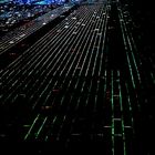 NEW YORK CITY AT NIGHT, AS SEEN THROUGH THE COCKPIT OF A JET ABOUT TO LAND