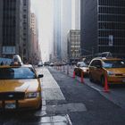 NEW YORK * Yellow cabs in the street canyon