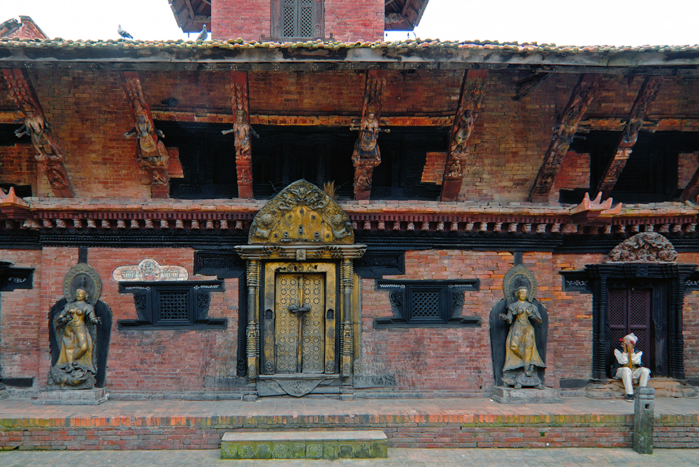 Newa man sitting at the door to the temple