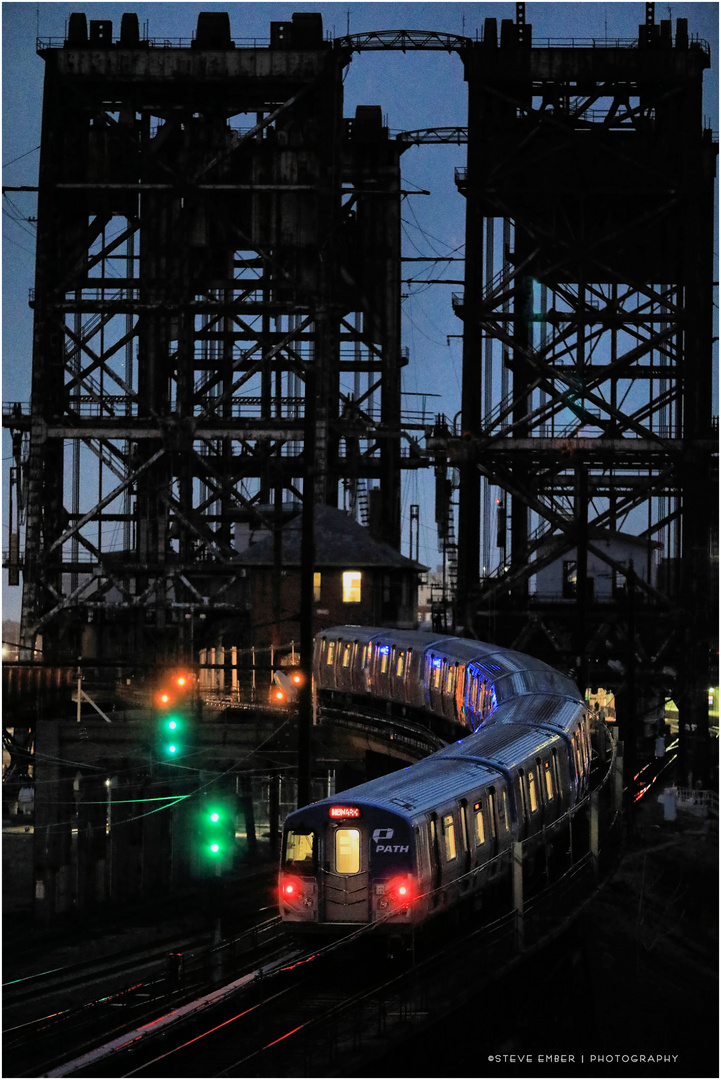 Newark-bound PATH Train Climbs Ramp to Dock Bridge in Blue Hour