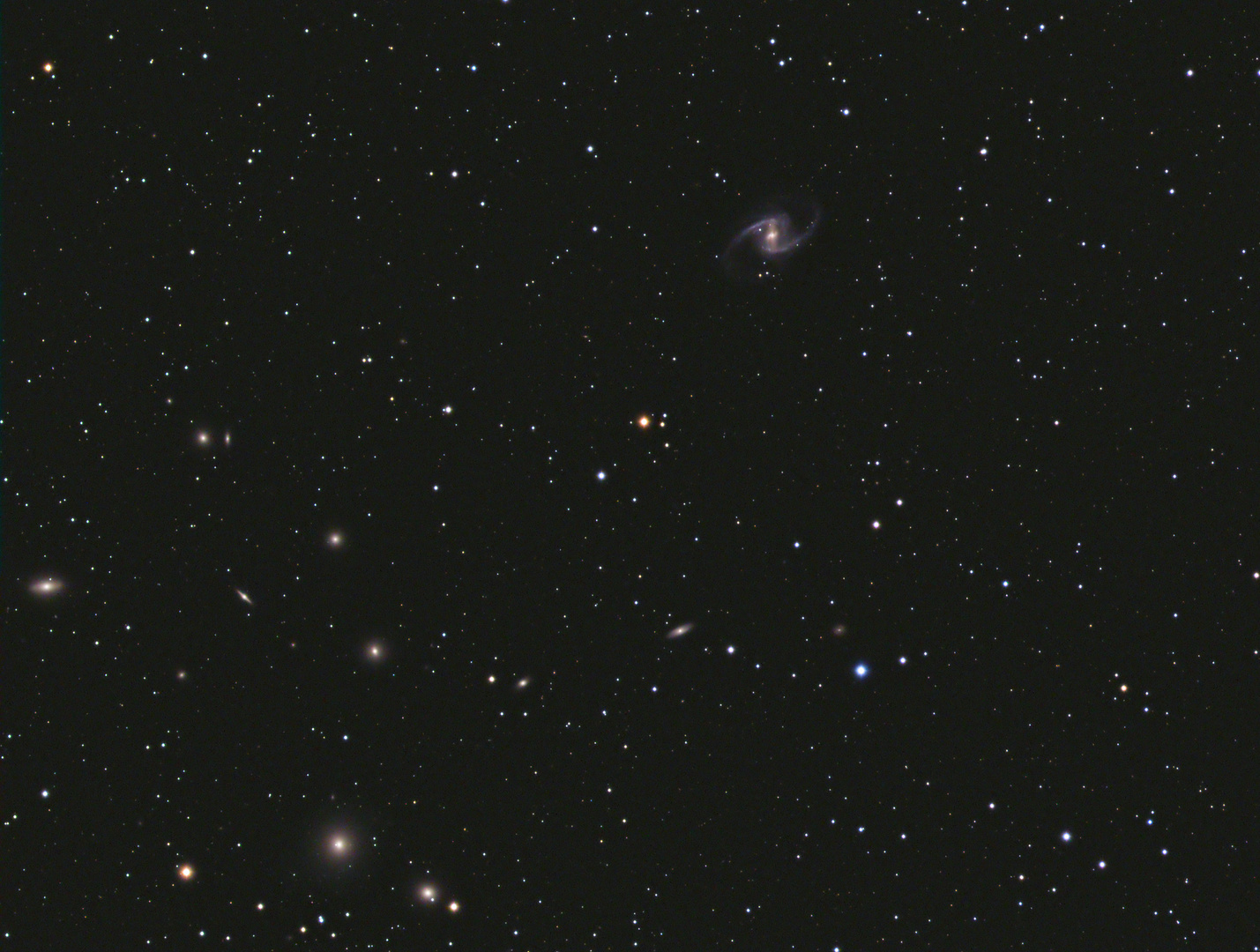 NGC 1365 - eine Balkenspirale und ihre Freunde