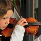 Noor playing the violin