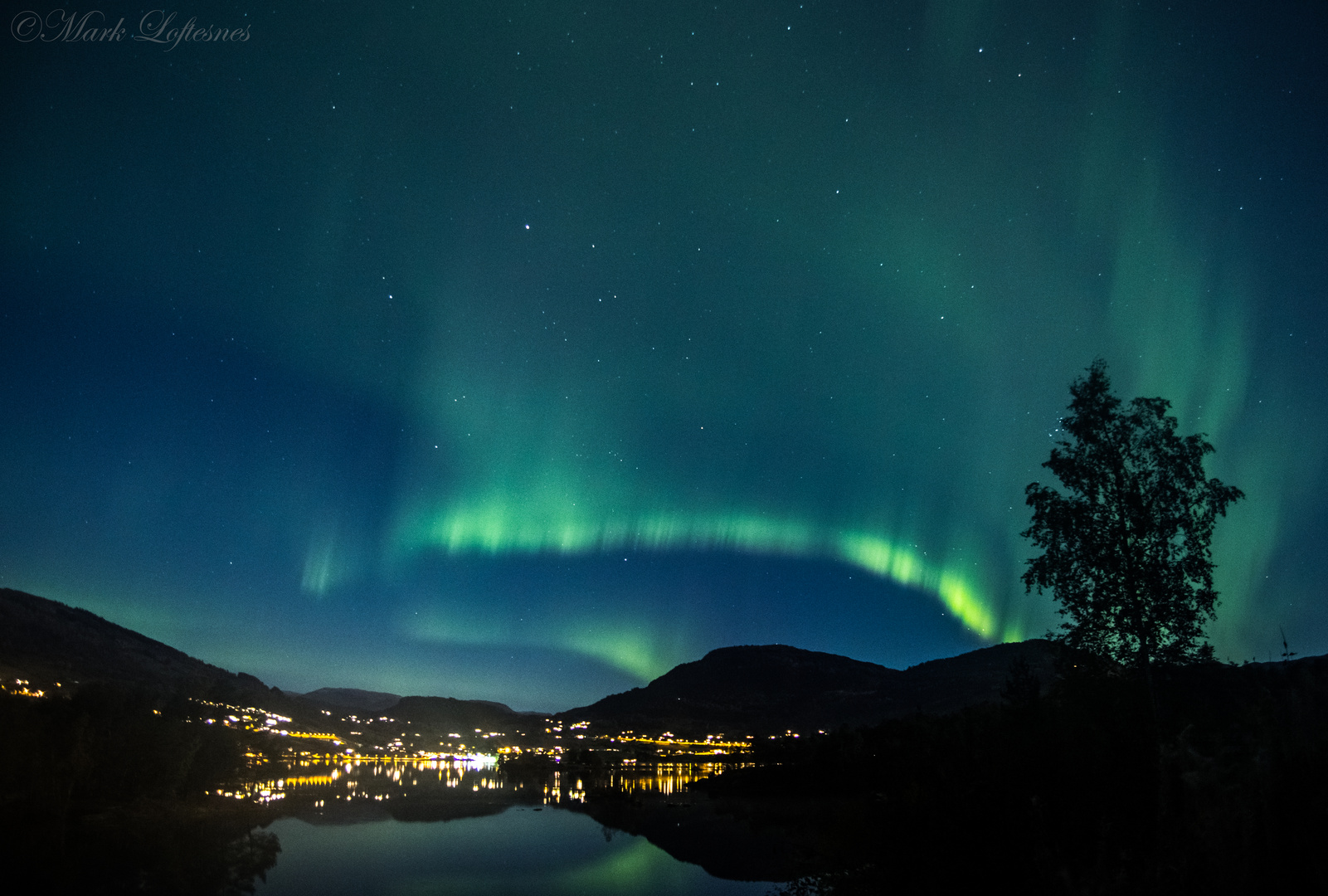 Northern lights over houses