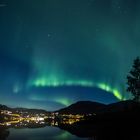 Northern lights over houses