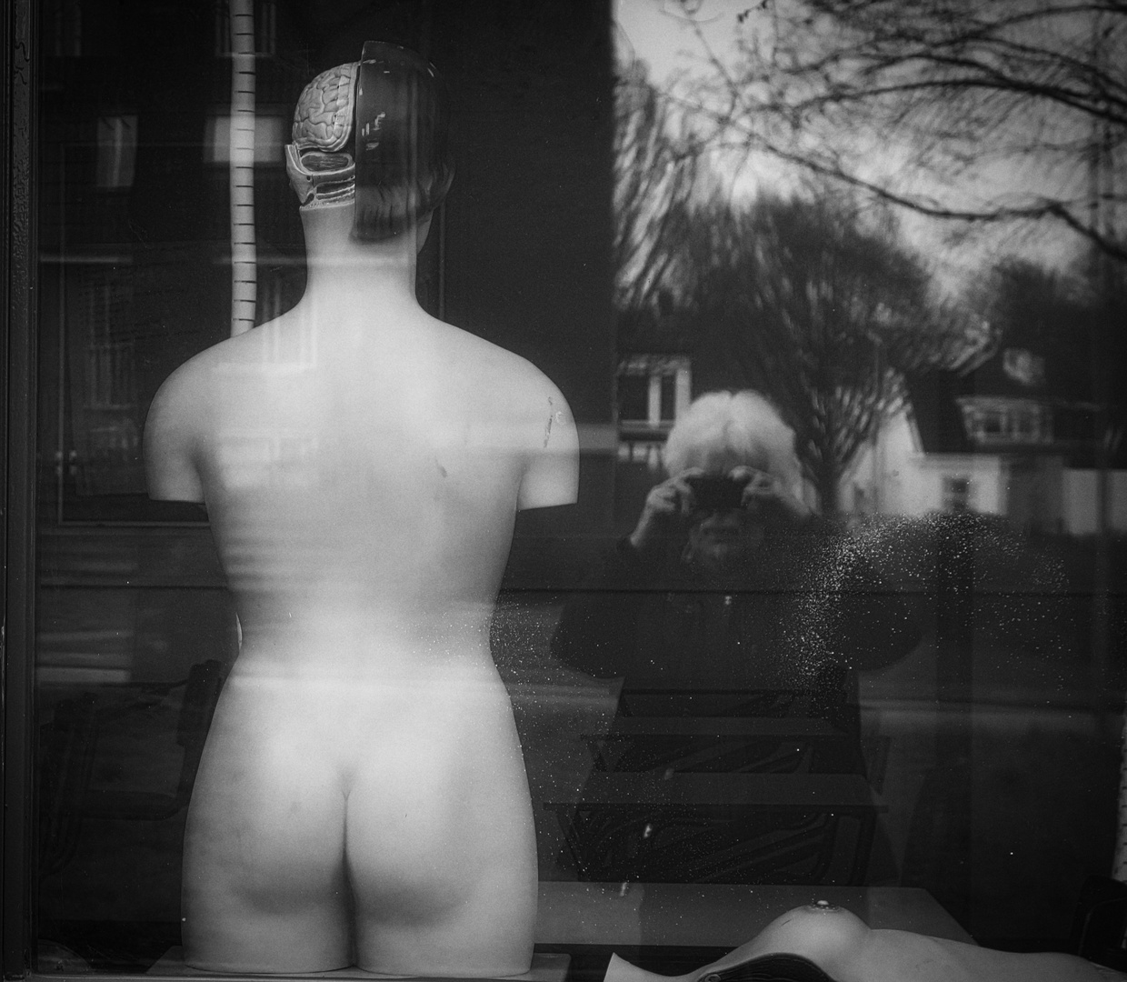 Nude model and a grey picture taker.