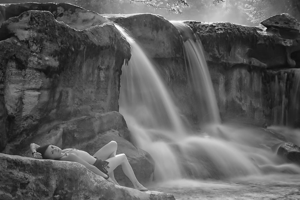 nude photo with a long exposure of a waterfall