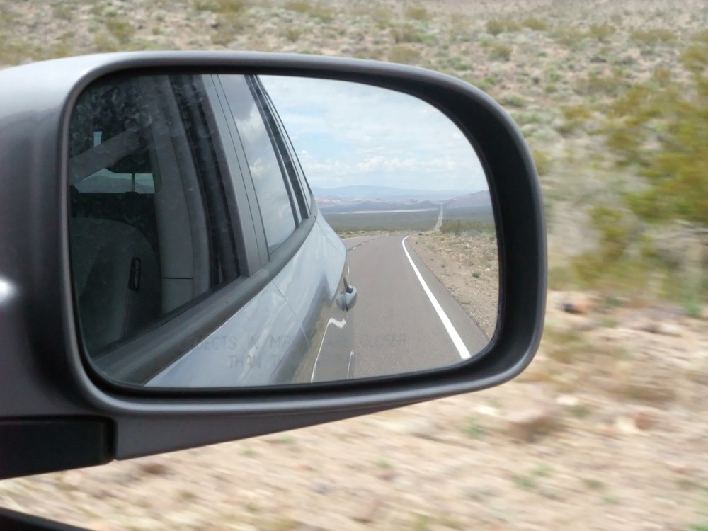 Objects in the rear view mirror may appear closer than they are