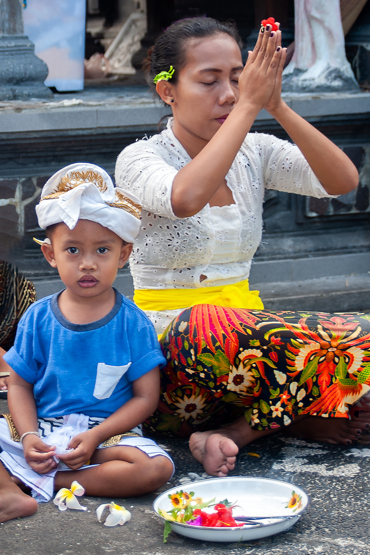 Odalan praying in the village