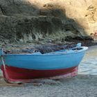 Old boat in blue and red