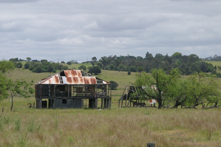  old damaged farm house and shed