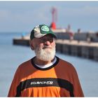 Old fisherman on the dock boat