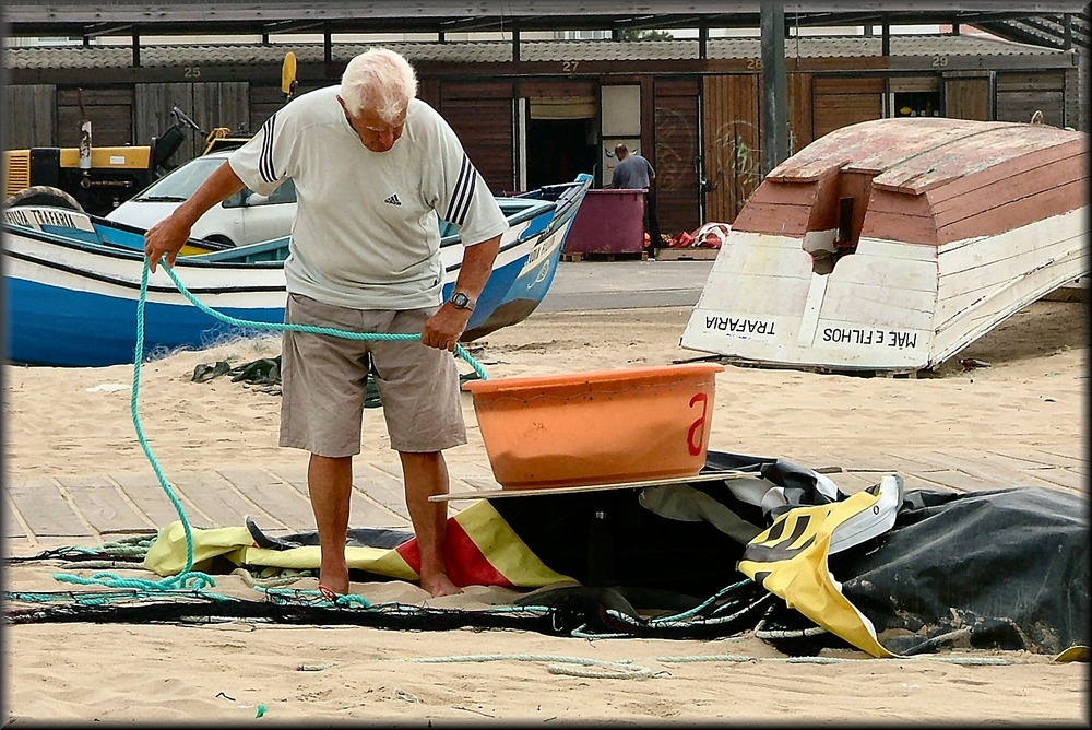 Old fishermn at work