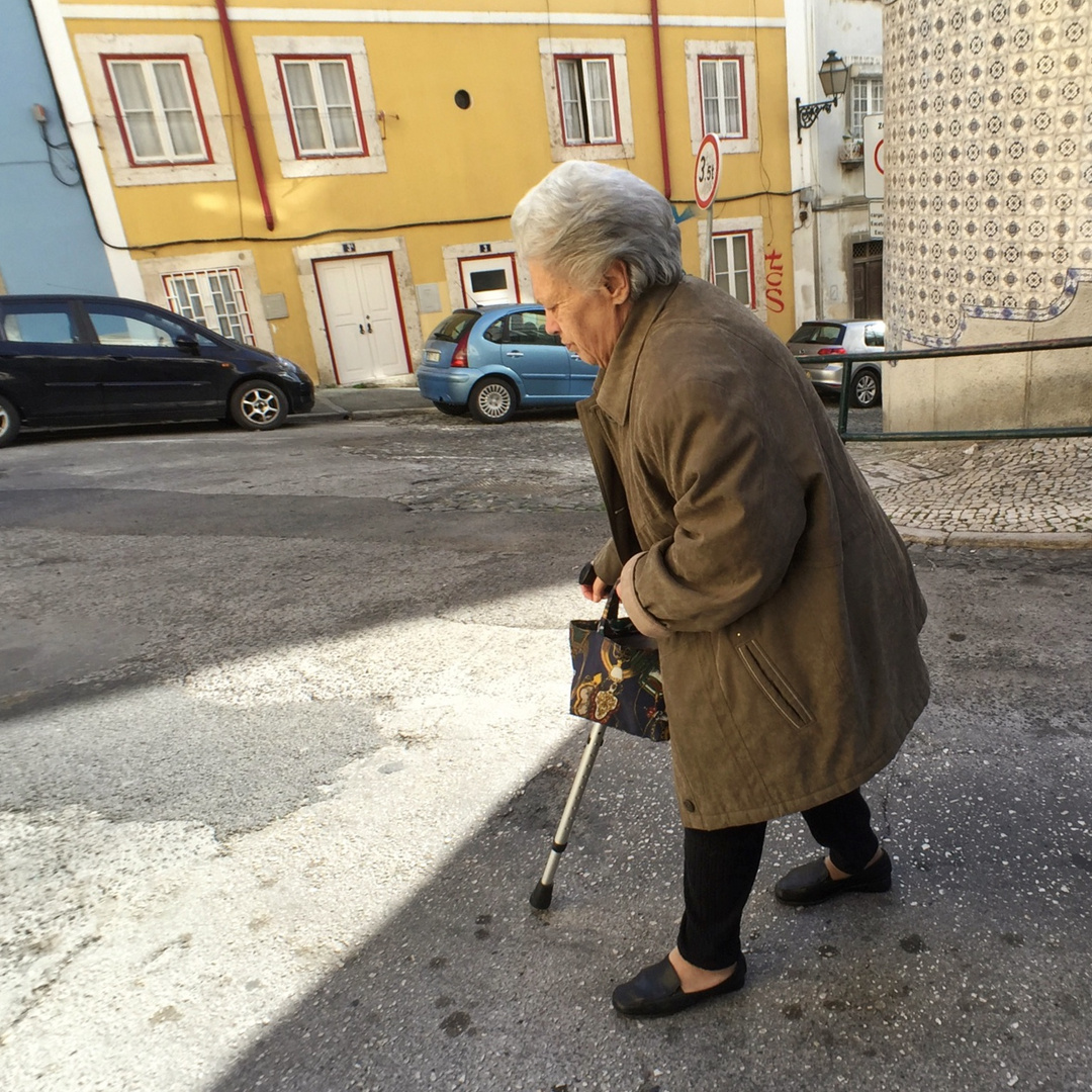 Old lady on steep street-Lisbon