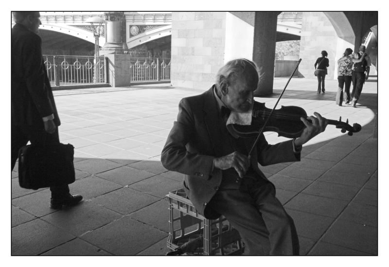 Old man playing violin