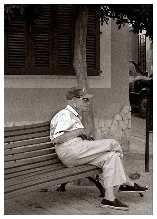 old man waiting for bus...