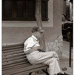 old man waiting for bus...