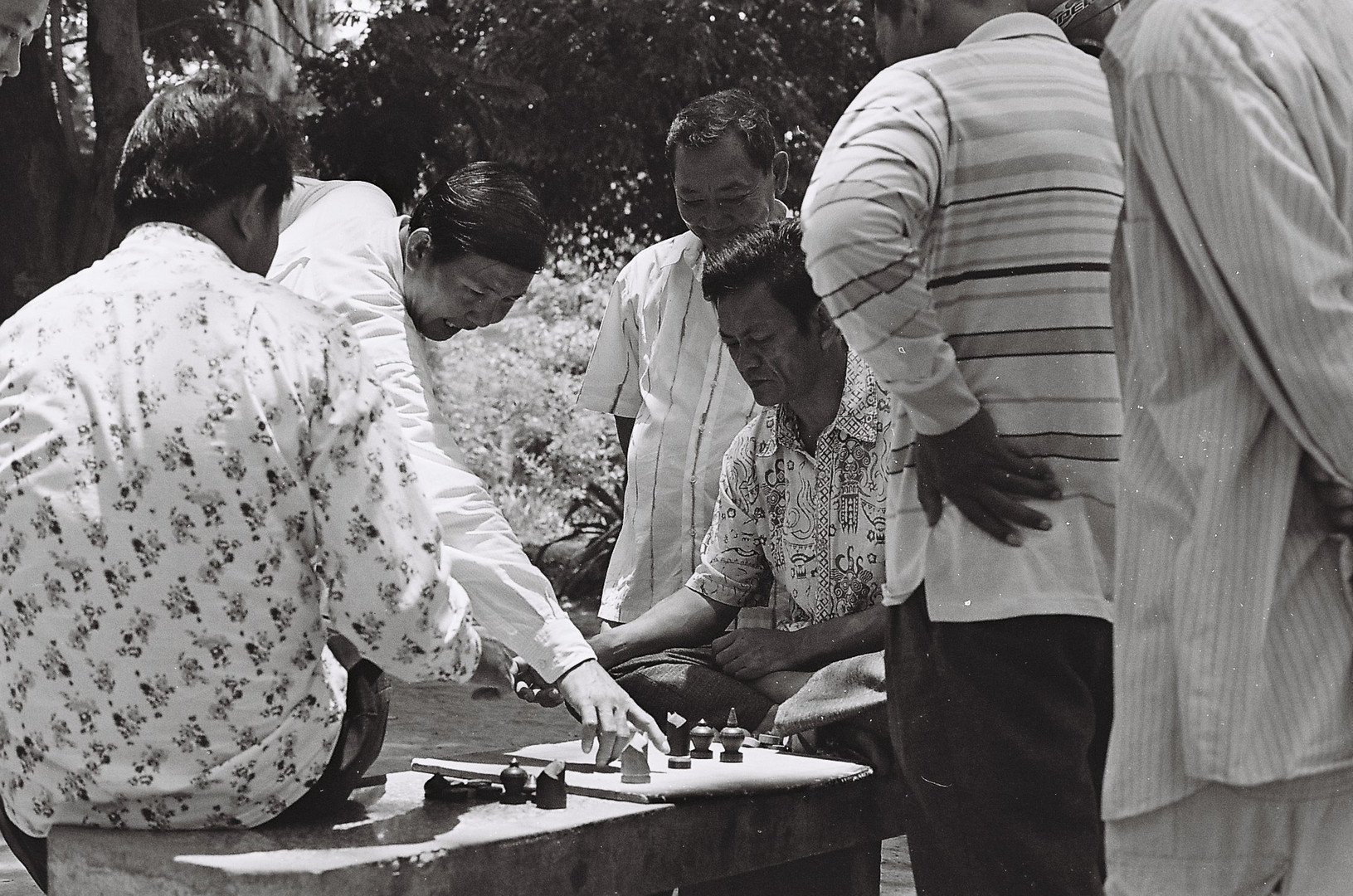 old men playing Ouk in the park