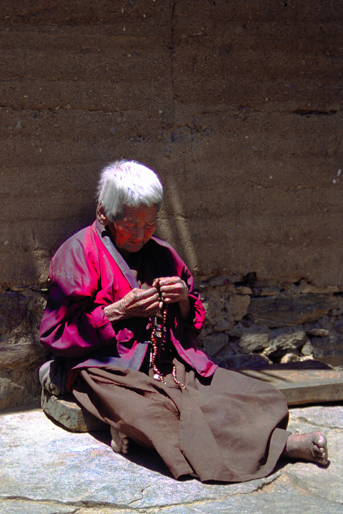 Old nun spins her mala