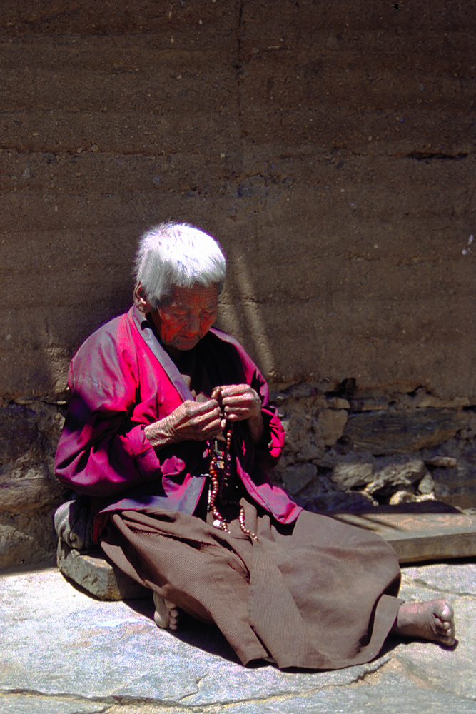 Old nun spins her mala