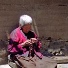 Old nun spins her mala