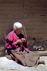 Old nun spins her mala