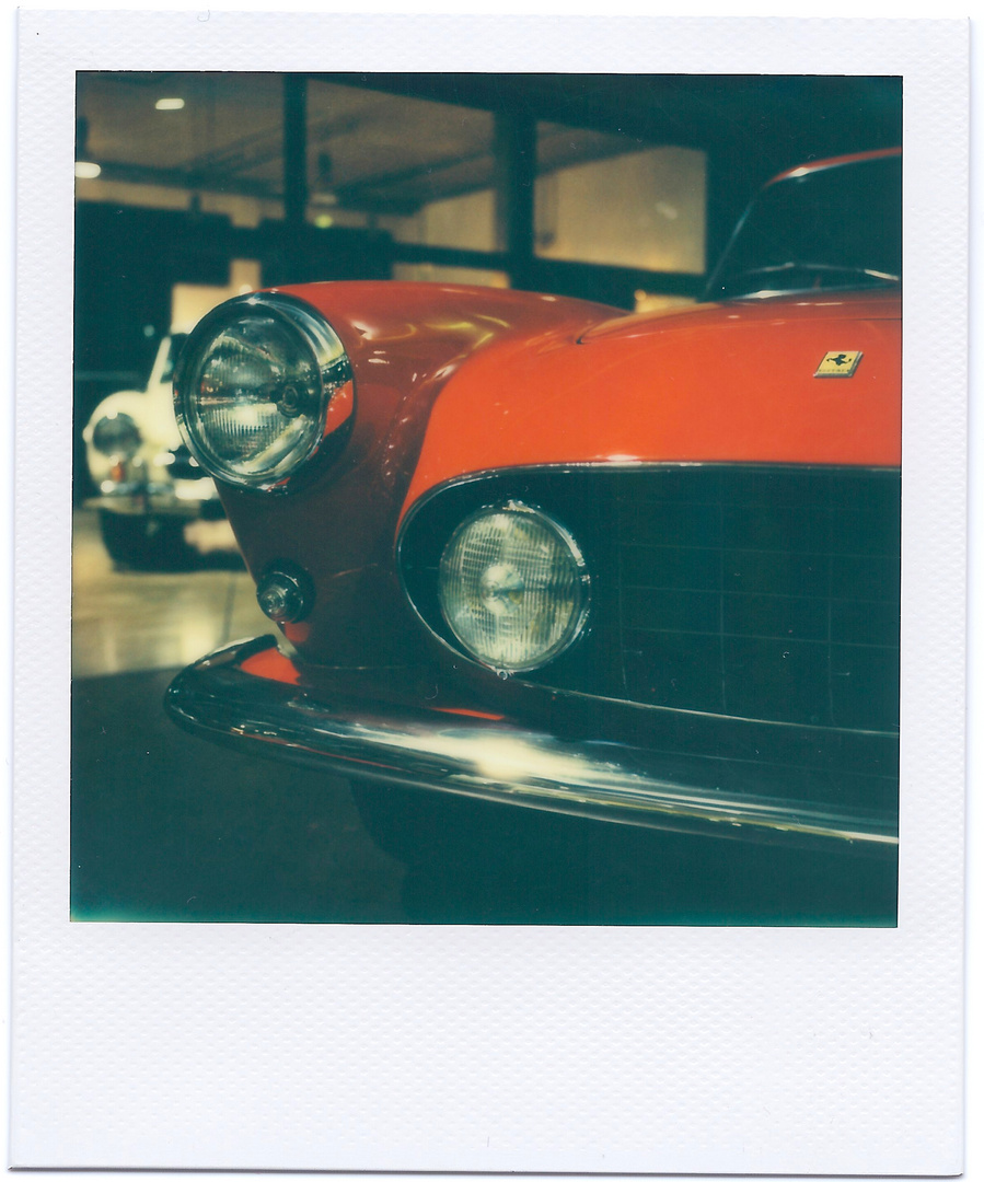 old red Ferrari / Polaroid SX70 - Impossible