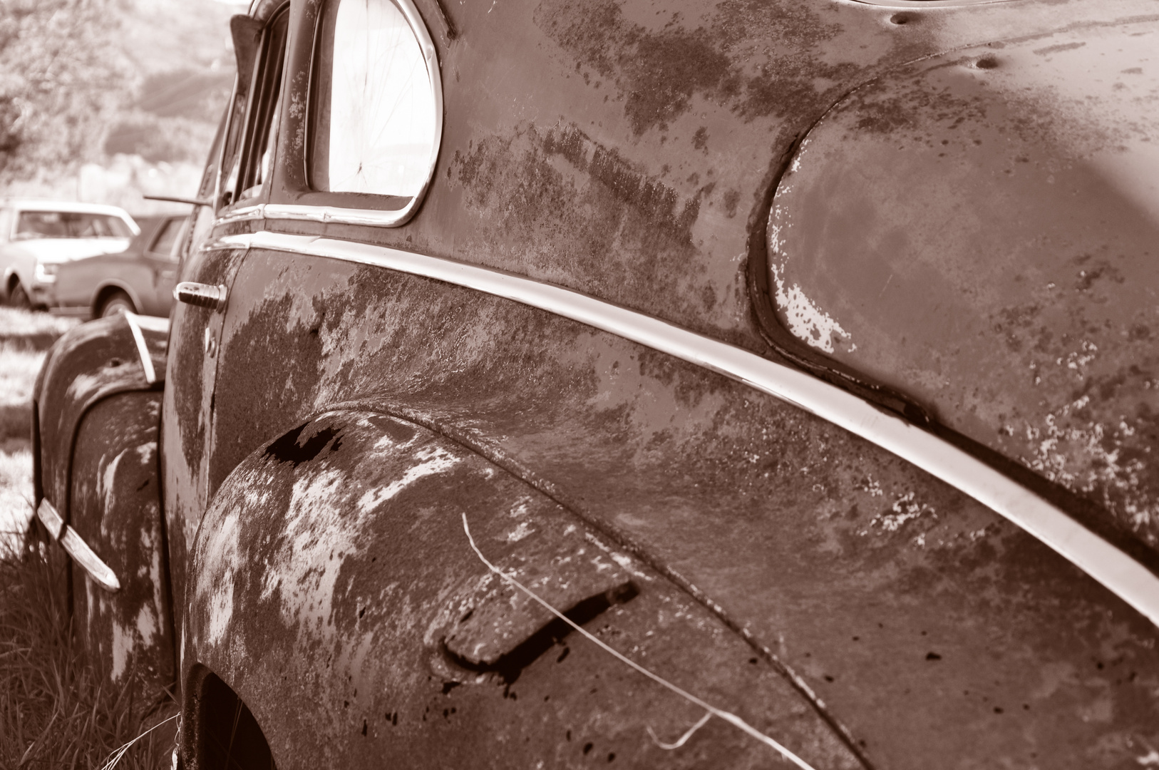 old rusty automobile on car graveyard