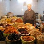 Old salesman at Ardabil Bazaar, selling dreid fruits