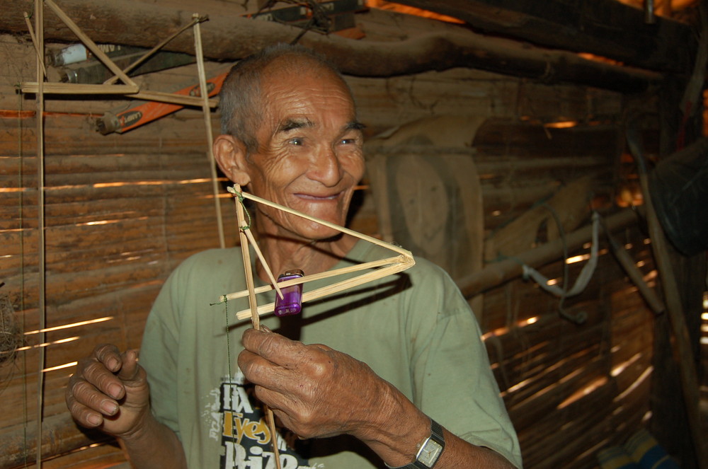 Old Thai with bird trap