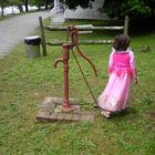 old water pump with Maya walking away