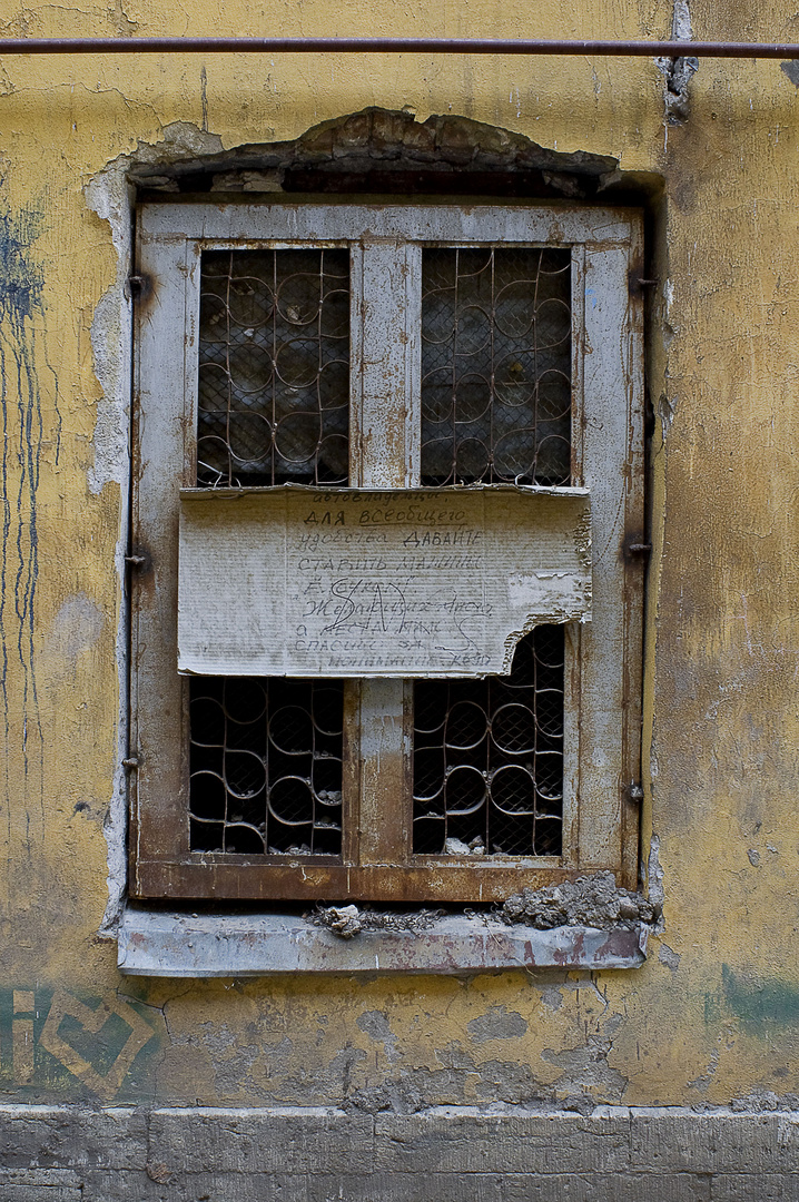 Old window with a sign.Vasilievsky Island.