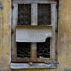 Old window with a sign.Vasilievsky Island.