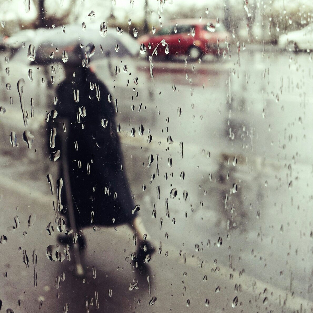 old woman in the rain