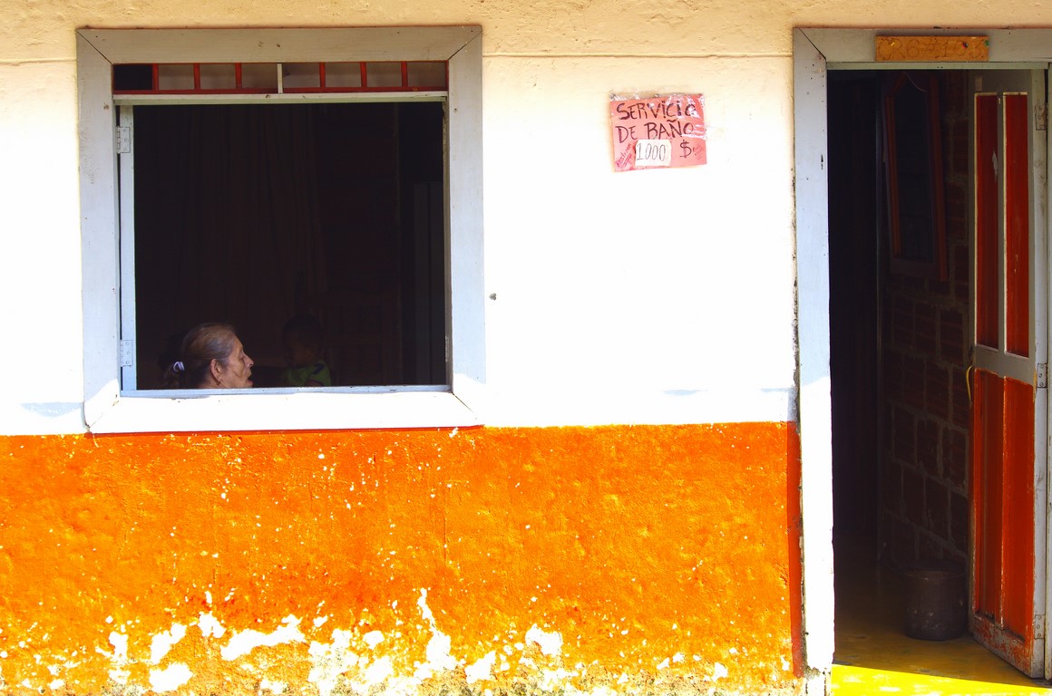 Old woman sitting at home