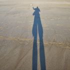 Ombre du photographe sur une plage en Bretagne