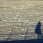 Ombres du photographe sur la jetée