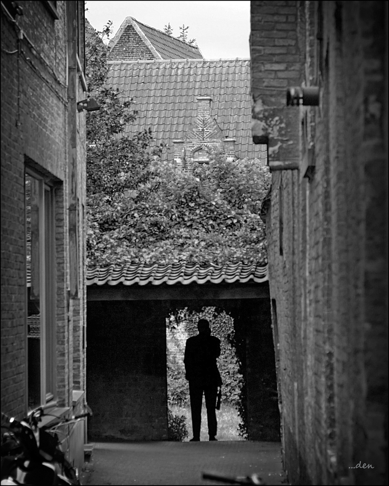 On the Cell in Bruges, with Umbrella at the Ready......