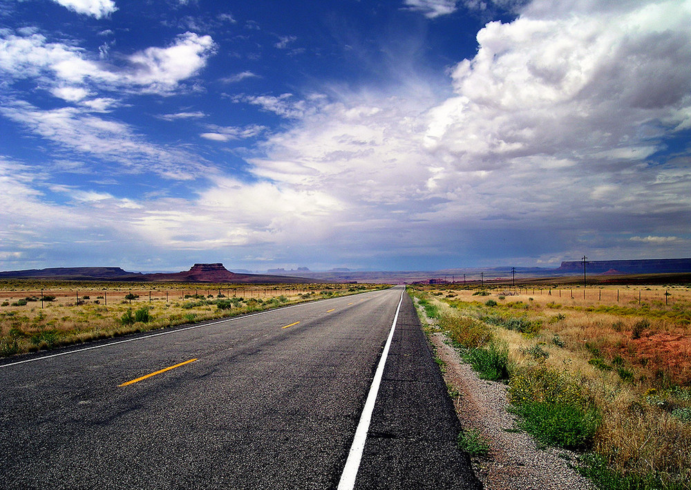 On the road under a blue sky