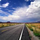 On the road under a blue sky