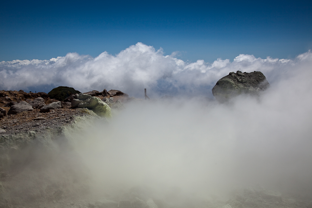 on top of the vulcano and above the clouds