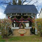 Osterbrunnen auf Weinpresse