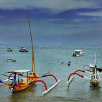 Outrigger boats on low tide in Sanur