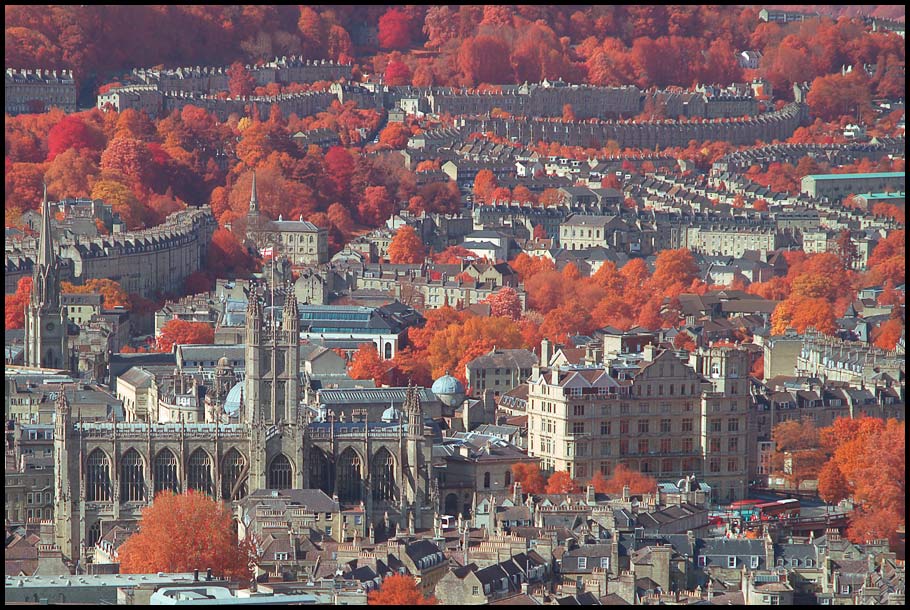 Over a City with lots of trees.