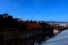 Over the rooftops and houses ...