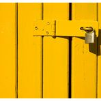 padlock on yellow door