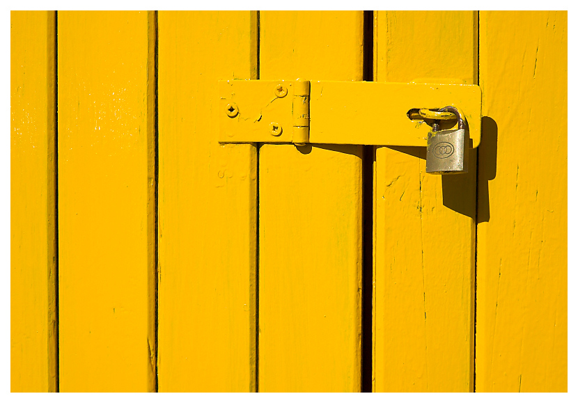 padlock on yellow door