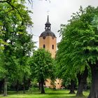 Park des Schlosses Brühl und die Kirche von Brody