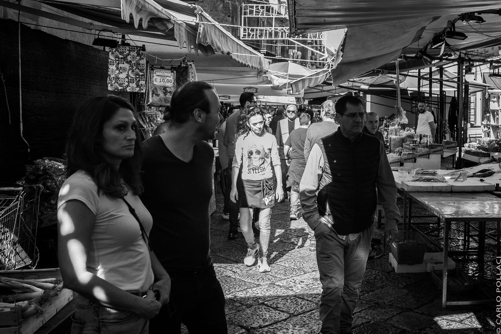 Passers-by at the popular market