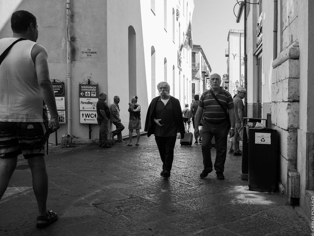 Passers-by, in the main street of the old city