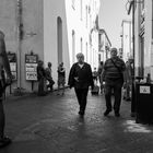 Passers-by, in the main street of the old city